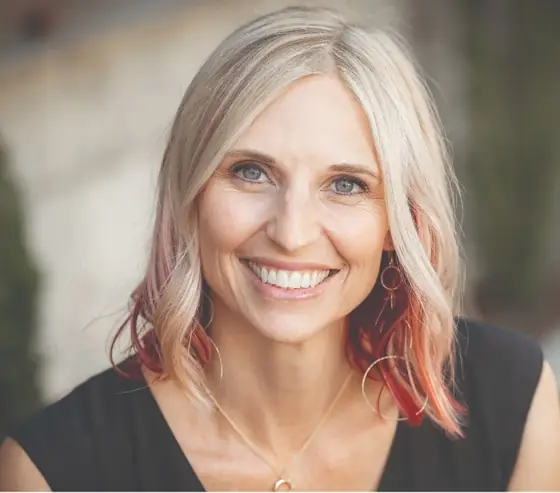 Beckie Seba, smiling, outdoors in Bentonville